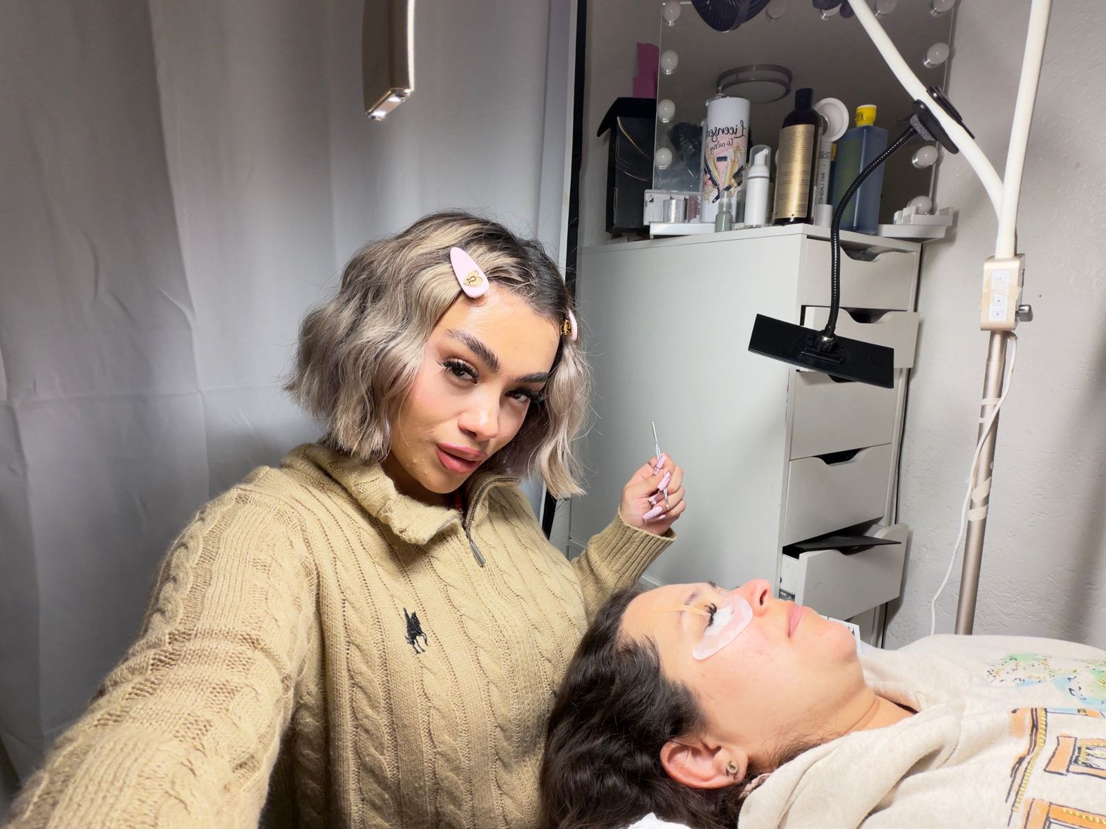 Gem taking a selfie while lashing a client